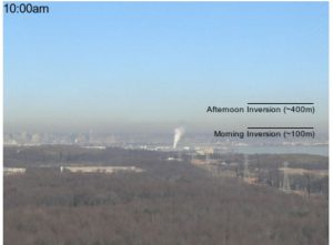 Air pollution hangs over downtown Baltimore in this photo from early January 2016.22A winter weather condition, known as an inversion, can trap pollution from cars, industrial activity and other combustion sources close to the ground. The markings on the image show how the pollution lifted during the day as the air warmed up. Credit: Maryland Department of the Environment