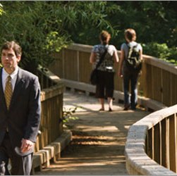 students walking on CERA board walk