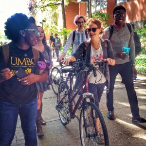 students walking with bicycles